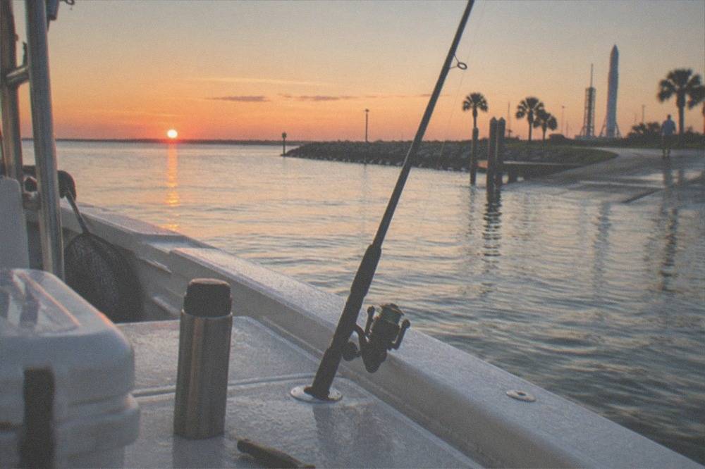A calm Atlantic horizon at sunrise seen from the deck of a fishing boat