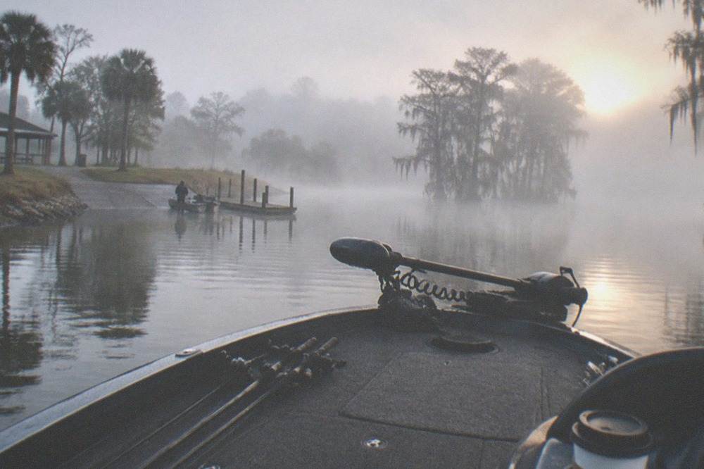 sunrise over a Florida bass lake with mist on the water